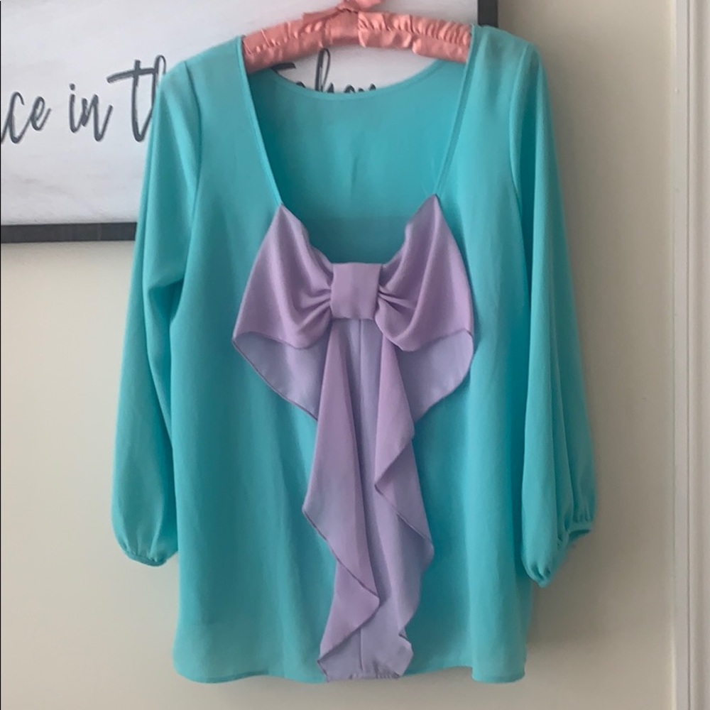 Tiffany blue blouse with a bow on it 🎀